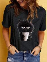 Load image into Gallery viewer, Person wearing a black t-shirt with a cartoon cat holding a cup design