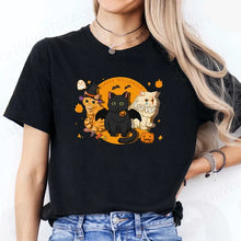 Load image into Gallery viewer, Person wearing a black t-shirt with Halloween-themed cat design. - Moonlight Meowgic Halloween Tee - Black -JBCoolCats