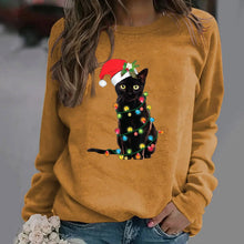 Load image into Gallery viewer, A person wearing a Khaki sweatshirt with a graphic of a black cat wearing a Santa hat and adorned with Christmas lights.  Twinkle Paws Christmas Cat Sweatshirt - Christmas - JBCoolCats