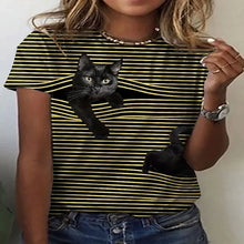 Load image into Gallery viewer, Person wearing a black and yellow striped t-shirt with a black cat  cat  peeking out graphic. Stripe and Seek: The Curious Cat T-Shirt - Sunbeam Stretch - JBCoolCats.
