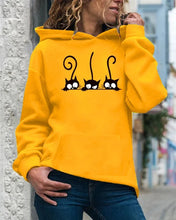 Load image into Gallery viewer, Person wearing a yellow hoodie with cat designs - Peeking Purrfection Kittie Hoodie - Sunpounce Yellow- JBCoolCats