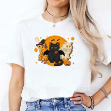 Load image into Gallery viewer, Person wearing a black t-shirt with Halloween-themed cat design. - Moonlight Meowgic Halloween Tee - White -JBCoolCats