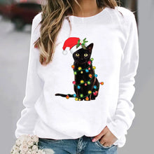 Load image into Gallery viewer, A person wearing a white sweatshirt with a graphic of a black cat wearing a Santa hat and adorned with Christmas lights.  Twinkle Paws Christmas Cat Sweatshirt - Christmas - JBCoolCats