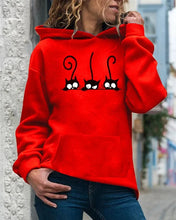 Load image into Gallery viewer, Person wearing a red hoodie with cat designs, Peeking Purrfection Kittie Hoodie - Cherry Catnap Red - JBCoolCats