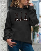 Load image into Gallery viewer, Person wearing a black hoodie with cat design, Peeking Purrfection Kittie Hoodie - Midnight Mischief Black
- JBCoolCats