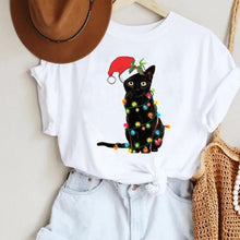 Load image into Gallery viewer, A white t-shirt with a printed image of a black cat wearing a Santa hat and wrapped in Christmas lights Twinkle Paws Christmas Cat T-Shirt – Christmas - JBCoolCats