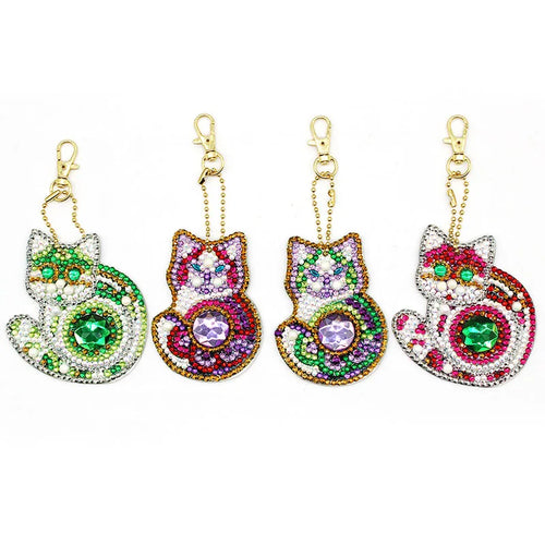 Four colorful cat-shaped keychains with gemstones Ultimate Cat & Paw Keychain Trio - Glamour Paws - JBCoolCats