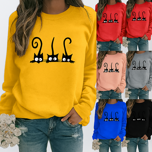 Yellow  sweatshirt with black cat design worn by a person, surrounded by other colored sweatshirts. Peeking Purrfection Kittie Sweatshirt  - JBCoolCats