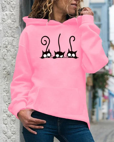 Person wearing a pink hoodie with black cat designs, Peeking Purrfection Kittie Hoodie - Clothing - JBCoolCats