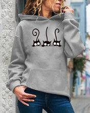 Load image into Gallery viewer, Person wearing a gray hoodie with cat designs, Peeking Purrfection Kittie Hoodie - Stormy Stare Gray - JBCoolCats