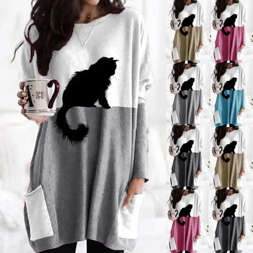 Woman wearing a long-sleeve shirt with a cat design, holding a mug with a similar design, on a white background.  - JBCoolCats