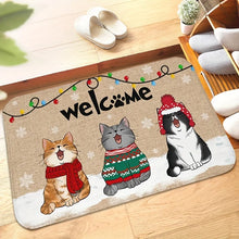 Load image into Gallery viewer, Decorative doormat with cartoon cats wearing winter clothing and a &#39;welcome&#39; sign. Welcome Cat Holiday Doormat - Christmas - JBCoolCats