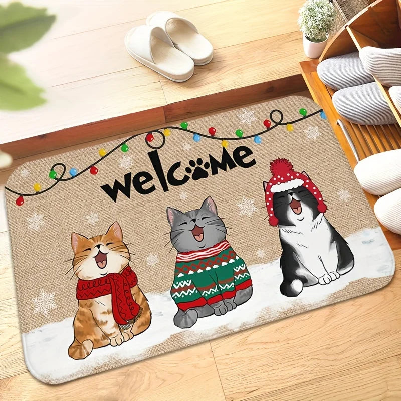 Decorative doormat with cartoon cats wearing winter clothing and a 'welcome' sign. Welcome Cat Holiday Doormat - Christmas - JBCoolCats