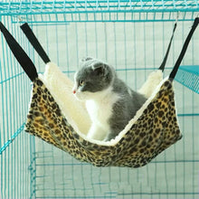 Load image into Gallery viewer, Cat sitting in a leopard print hammock inside a cage. The Purr‑fect Hangout Pet Hammock - Features- JBCoolCats