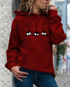Person wearing a burgundy  hoodie with cat designs, Peeking Purrfection Kittie Hoodie Purrberry Burgundy Wine - JBCoolCats