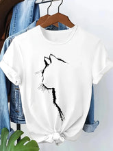 Load image into Gallery viewer, White t-shirt with black cat design hanging on a wooden hanger against a denim jacket. Chic Silhouette Cat Tee - Clothing - JBCoolCats