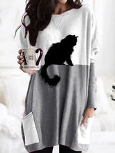 Load image into Gallery viewer, Woman wearing a long-sleeve white &amp; grayy shirt with a black cat design, holding a mug.   - JBCoolCats