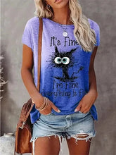 Load image into Gallery viewer, Person wearing a blue t-shirt with a cat graphic and text, standing against a neutral background. I’m Fine… Totally Feline Tee - Clothing - JBCoolCats