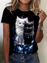 Load image into Gallery viewer, Person wearing a black t-shirt with two cats and blue crystals design. Crystal Purr‑fection Duo Tee - Clothing - JBCoolCats