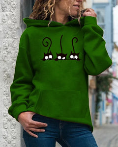 Person wearing a green hoodie with a cat design, Peeking Purrfection Kittie Hoodie - Whisker Woods Green - JBCoolCats