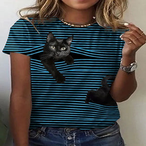Person wearing a blue and black striped t-shirt with a black cat cat  peeking out graphic. Stripe and Seek: The Curious Cat T-Shirt - Midnight Meow - JBCoolCats