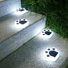 Load image into Gallery viewer, Solar lawn lights in the shape of cat paws, glowing in the dark, on granite stairs  - Cat Paw Solar Lawn Lights - Accessory - JBCoolCats