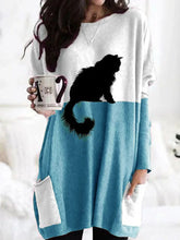 Load image into Gallery viewer, Woman wearing a white and blue dress with a black cat design, holding a mug.   - JBCoolCats