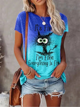 Load image into Gallery viewer, Person wearing a blue t-shirt with a graphic design and text, standing against a neutral background. I’m Fine… Totally Feline Tee - Clothing - JBCoolCats