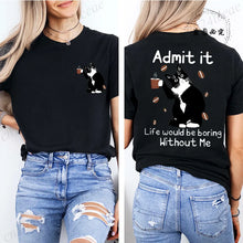 Load image into Gallery viewer, Black t-shirt with a cat graphic and text on the front and back, worn by a person.  Paws &amp; Applause T-shirt - Shadow Stalker - JBCoolCats