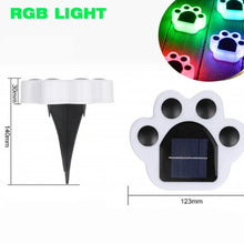 Load image into Gallery viewer, Solar lawn lights in the shape of cat paws, glowing in the dark, indicating they are illuminated. Cat Paw Solar Lawn Lights - Multicolor - JBCoolCats